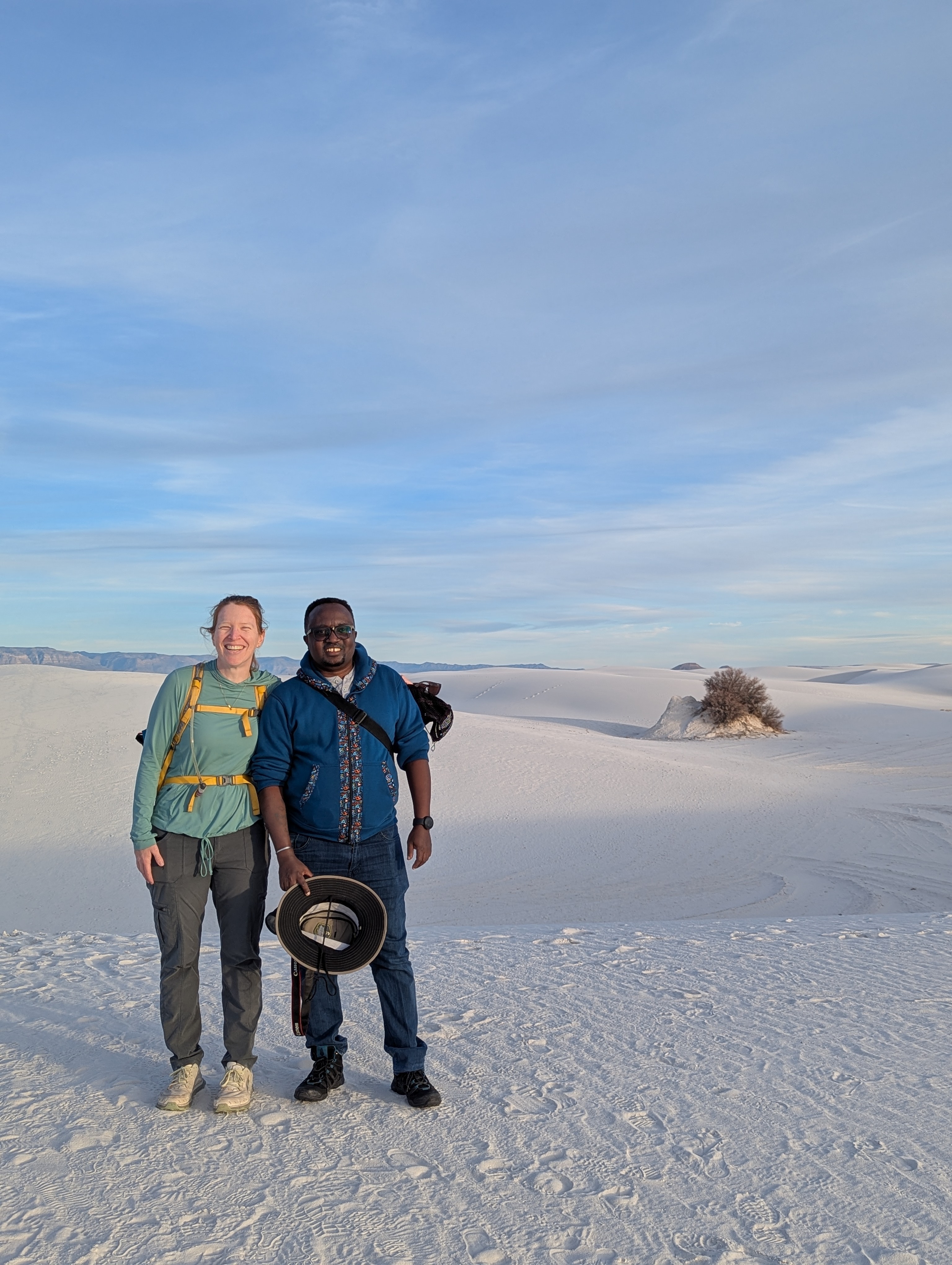 Theresa and David Kimiti smile near the end of a hike on the Alkali Flat Trail in White Sands National Park.